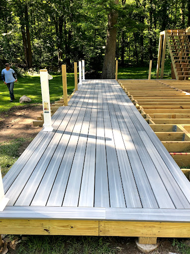 A large wooden deck in the middle of a park